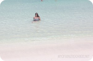 A person standing next to a body of water