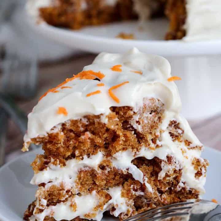 This easy Carrot Cake Recipe is moist and delicious, and has the perfect cream cheese icing ever. This cake is guaranteed to become one of your go-to dessert recipe for all occasions.