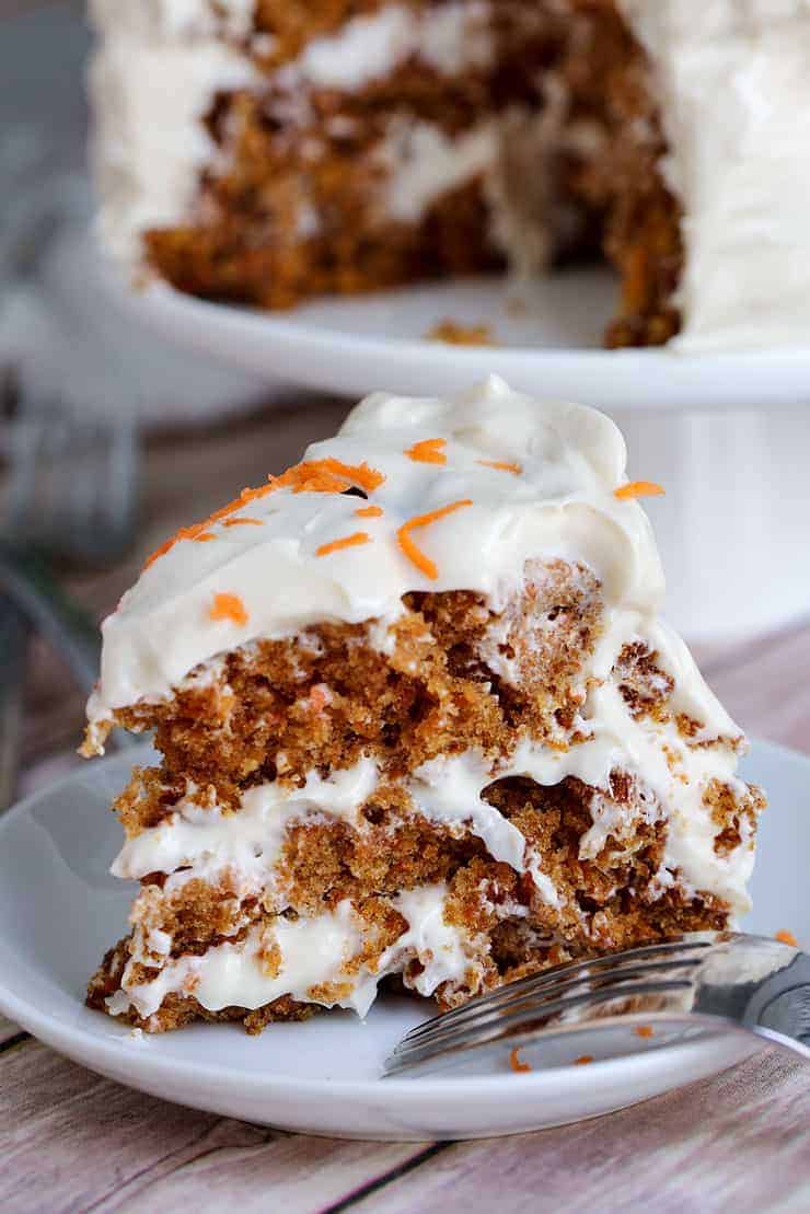 A piece of cake on a plate, with Carrot cake