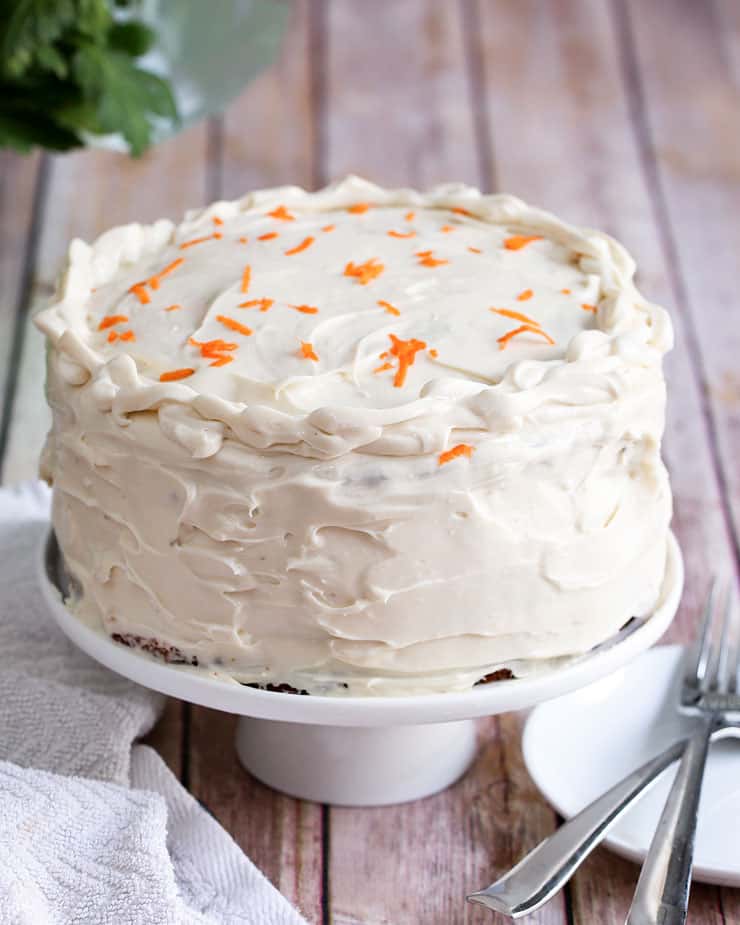 cake on top of a table, with carrot cake