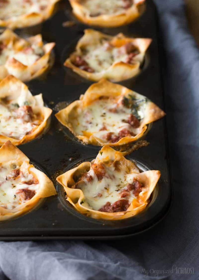 A close up of a slice of cooked lasagna cups in a baking pan