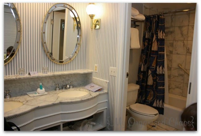 A room with a sink and a mirror, disney yacht club hotel