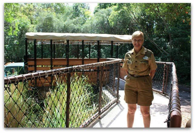 A man standing in front of a fence, with Wild Africa Trek