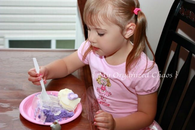 A little girl sitting at a table