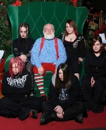 A group of people posing with santa, funny