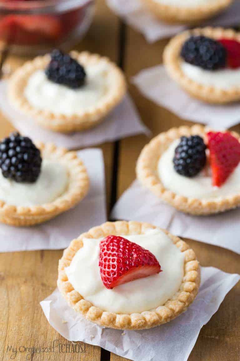 Mini Cream Cheese Fruit Tarts with fresh berries on top.