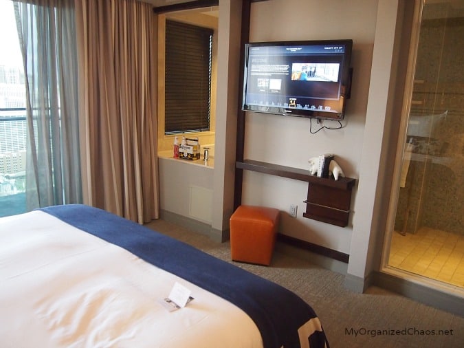 A hotel room with a bed and a window, at cosmopolitan las vegas