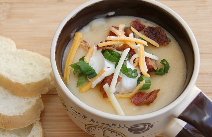 Slow Cooker Loaded Baked Potato Soup tastes just like a loaded baked potato - very rich, think and creamy. Heaven with each spoonful!