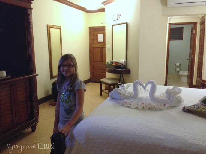 A little girl standing in a room, at beaches negril resort