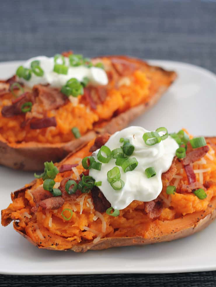 Loaded Sweet Potato Skins are sweet in taste with mouthwatering cheese and bacon, and some creamy sour cream and chives. perfection!