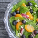 A bowl of fruit salad on a plate
