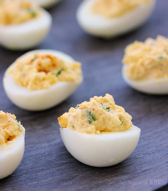 A bunch of food on a plate, with devilled eggs