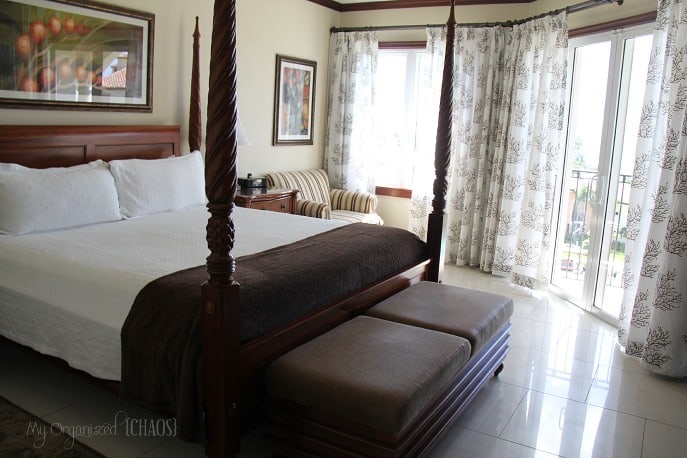 A bedroom with a bed and a window, at beaches turks and caicos