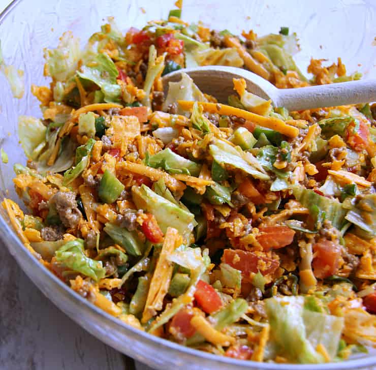 This Taco Salad recipe is my go-to when I want a quick and easy meal. I love the spices and crunch! Plus, it's a hit for dinners and a potluck salad!