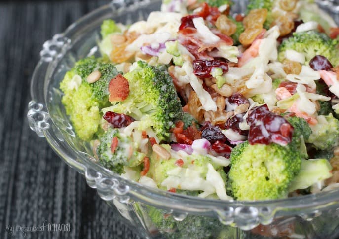 A dish is filled with food, with Salad and Broccoli