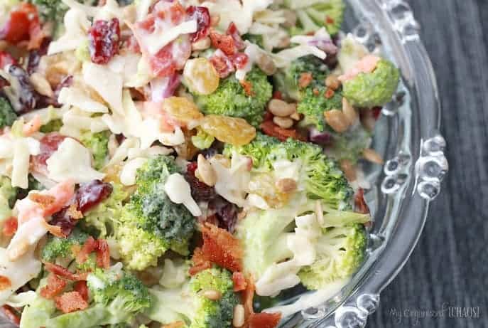 A close up of a bowl of salad, with Broccoli and Raisin