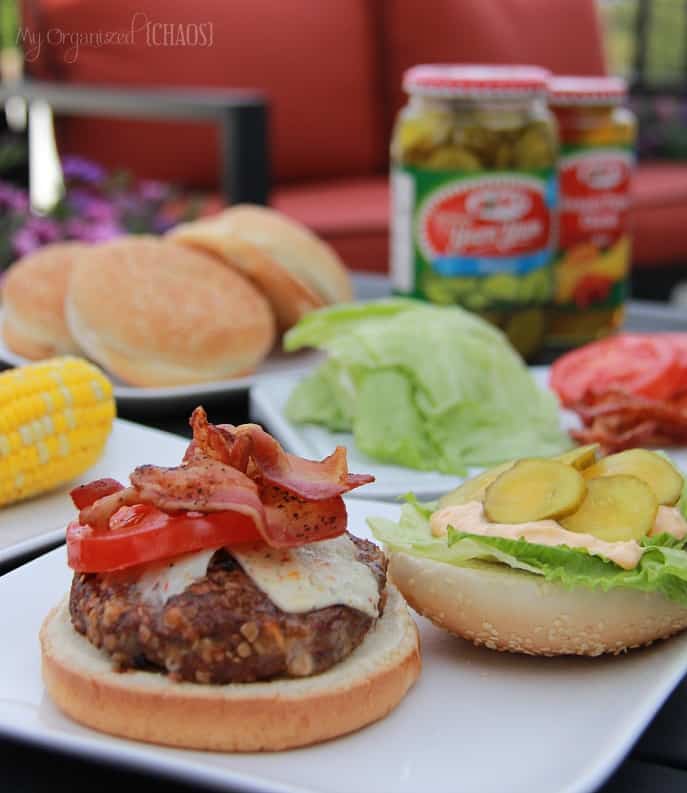 A plate of food on a table, with Burger and side