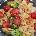 A dish is filled with food, with Salad and Pasta