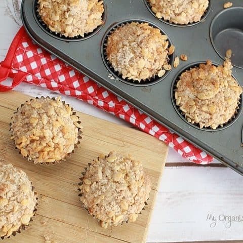 food sitting on top of a wooden table, with Apple Cinnamon Streusel Muffins