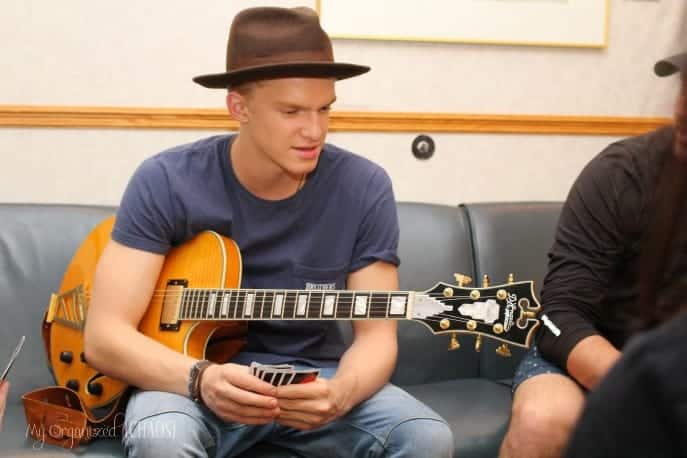Cody Simpson holding a guitar