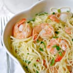 A bowl of food on a plate, with Shrimp and Scampi