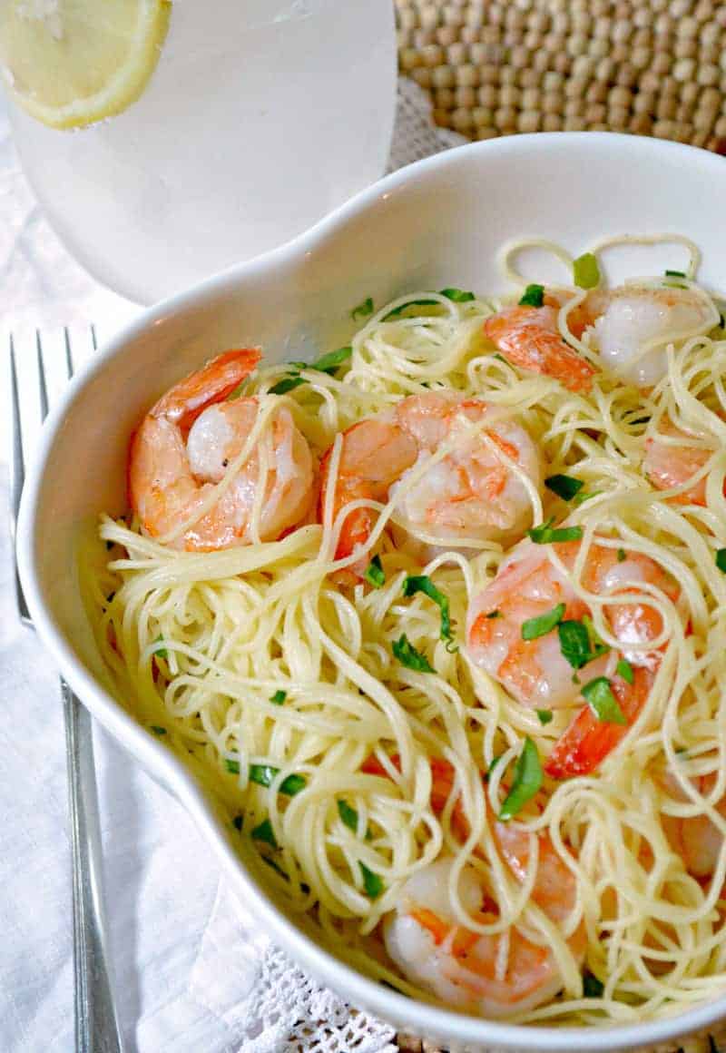 A bowl of food on a plate, with Shrimp and Scampi