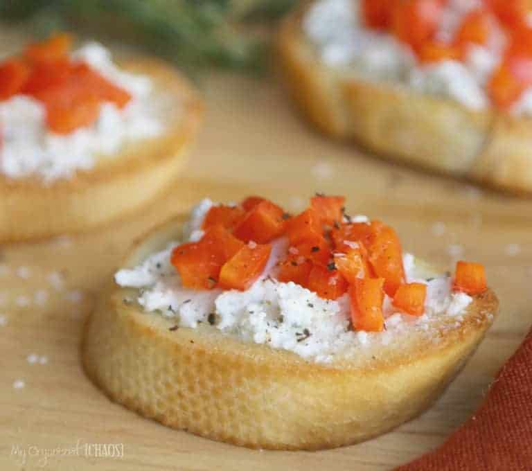 This Crusty Herbed Crostini Appetizer recipe is a crusty baguette, comforting goat cheese & a blend of herbs and red pepper - perfection!