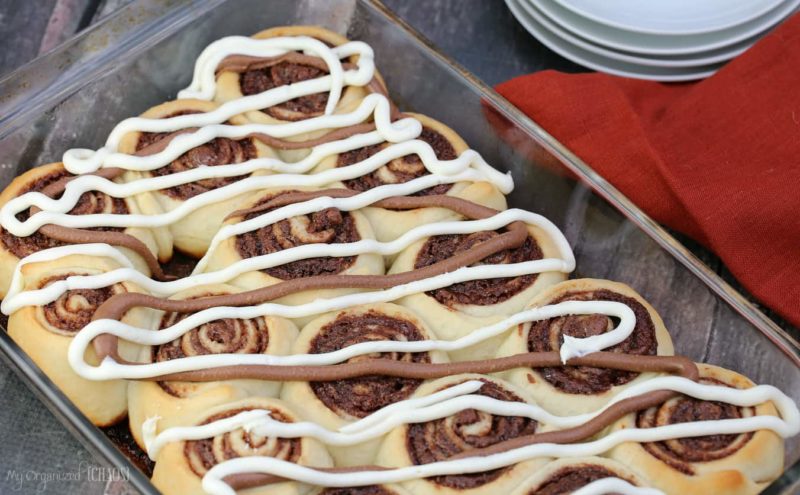 A tray of cinnamon buns sitting on a table