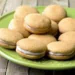 A plate of food, with sandwich cookies