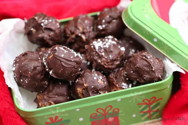 A container filled with food, with chocolate covered snowballs