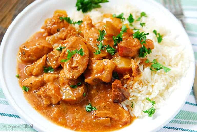 A plate of food, with Pork and Rice