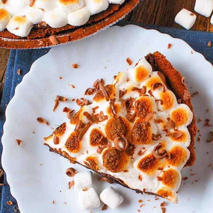 A slice of pie on a plate, with S'more and marshmallows