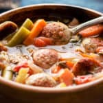 A bowl of food with stew, with Barley soup