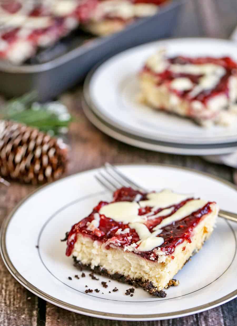 White Chocolate Raspberry Cheesecake Bars are sweet and tangy. The combination of an Oreo crust, white chocolate and raspberry jam is perfection