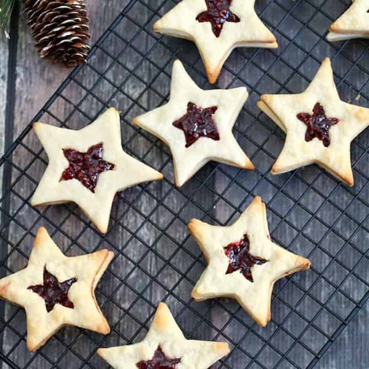 You can be the star of the holiday party or baking exchange with these Star-Shaped Jam Cookies. They are so festive, fun and elegant to make as a holiday treat.
