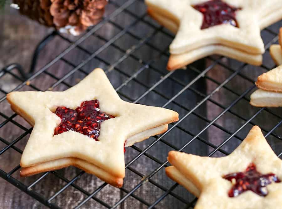 You can be the of the holiday party or baking exchange with these Star-Shaped Jam Cookies. They are so festive, fun and elegant to make as a holiday treat.