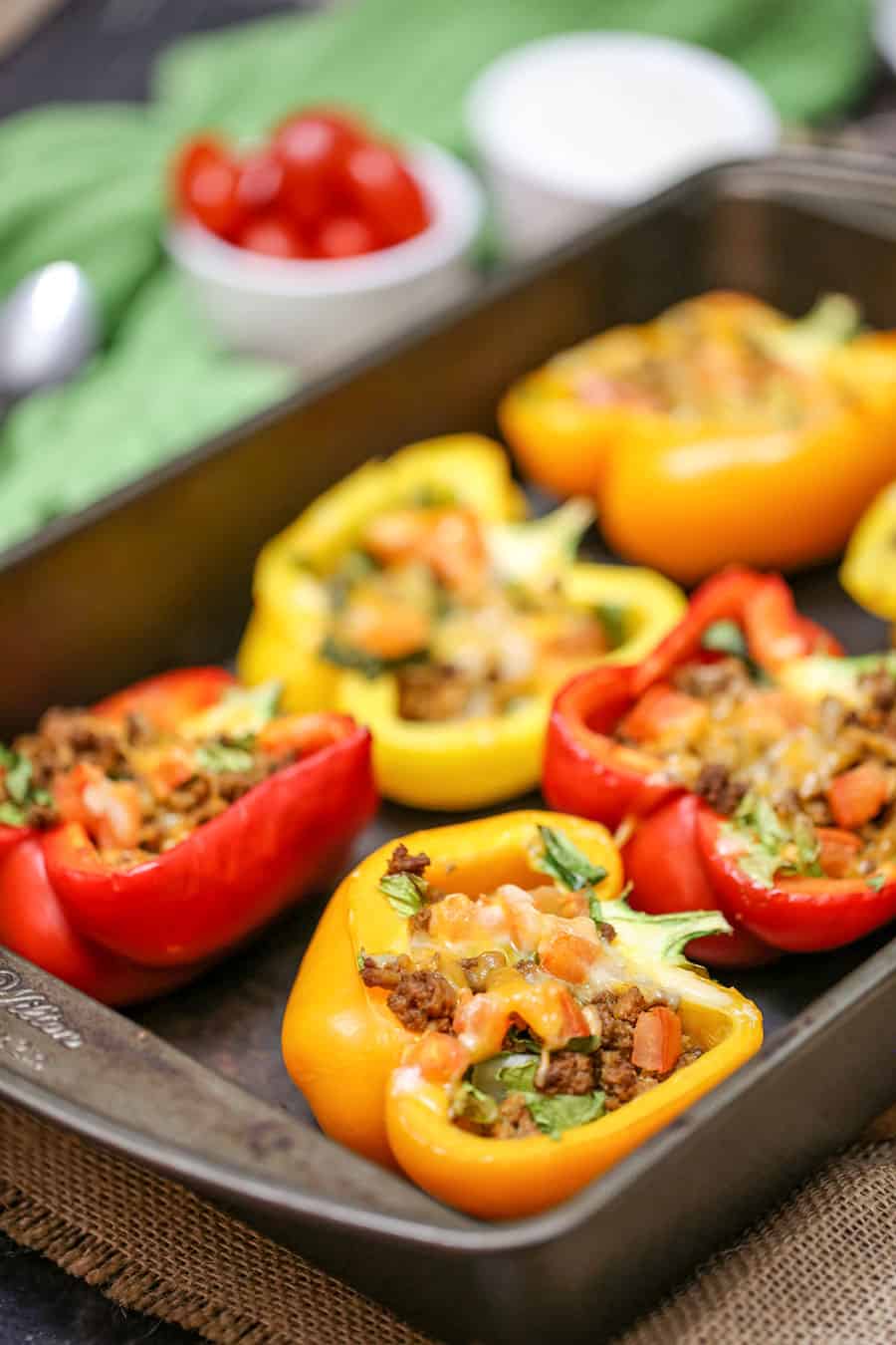 Bell Pepper Stuffed Tacos are baked with your favourite taco toppings inside, a great low-carb and low-calorie meal or appetizer option. With this no-fuss recipe, pre-cooking the bell peppers is not necessary.