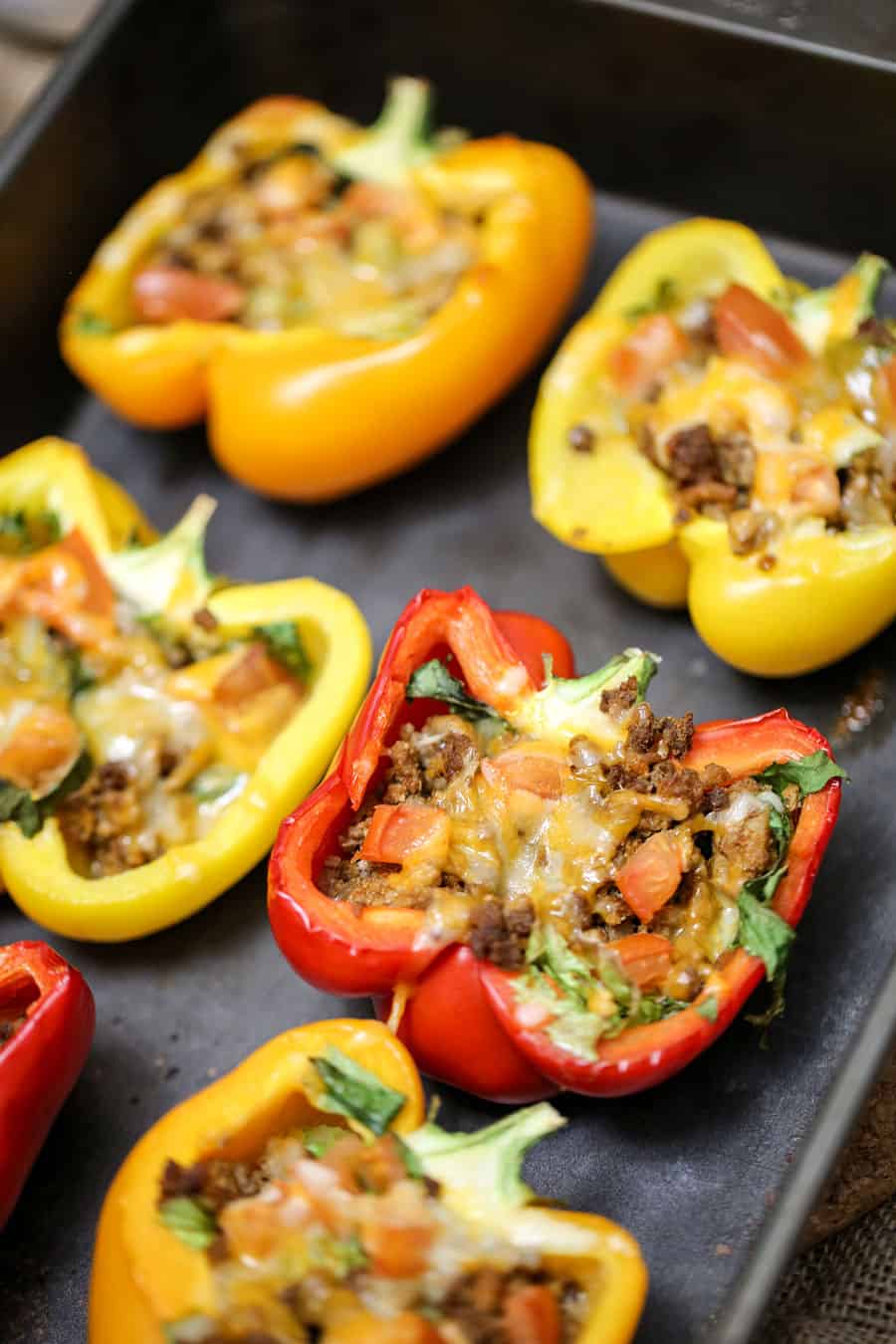 A tray of food, with Tacos and Bell Peppers