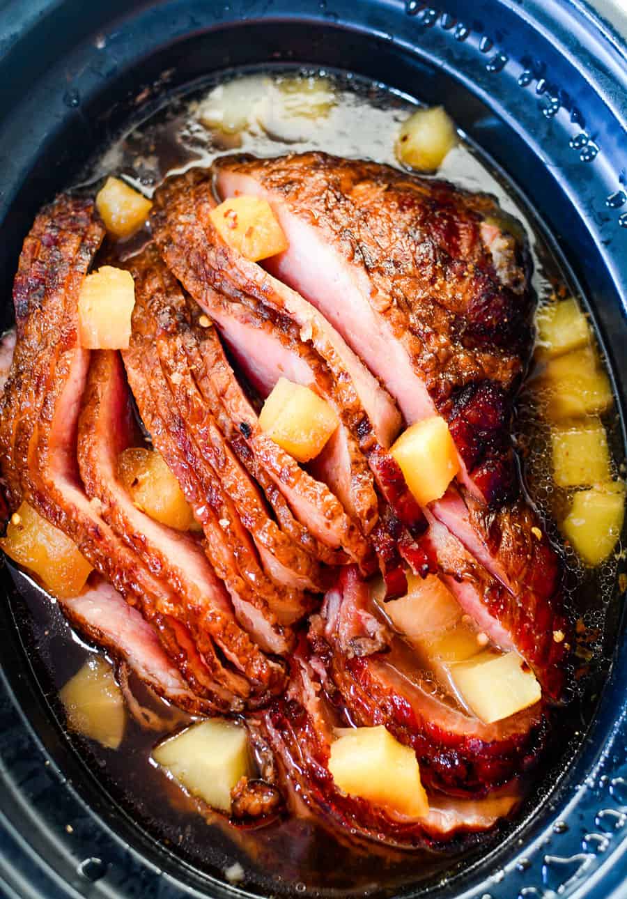 A pan of food in a slow cooker, with Ham and pineapple