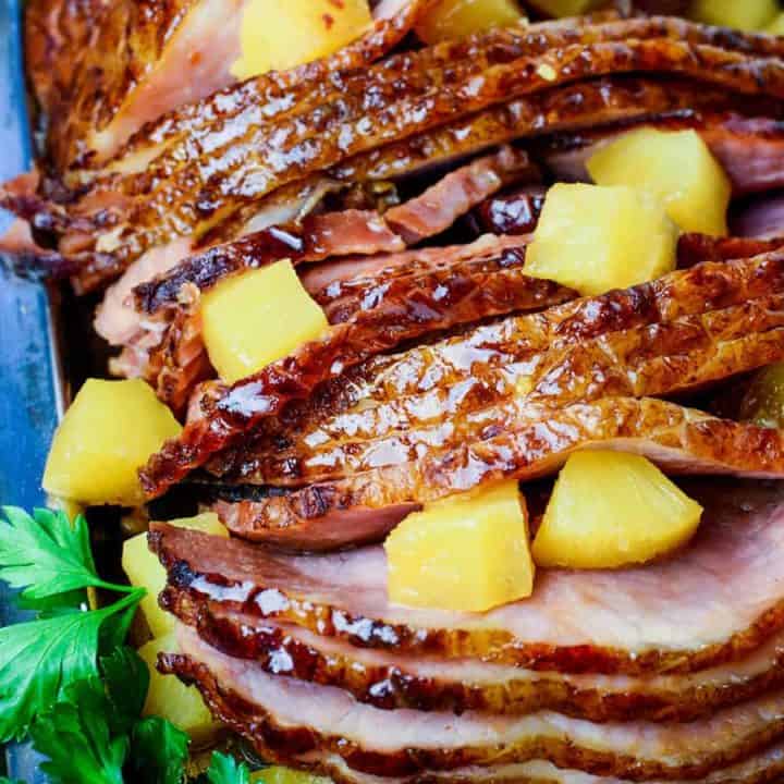 Slow Cooker Ham is a classic and iconic meal, yet there's so many variations on this recipe. Here is my go-to for the best Slow Cooker Brown Sugar Pineapple Ham ever, easy to make with just 5 ingredients - and so delicious!
