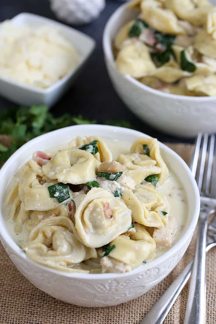 A bowl of food on a table, with Chicken and Tortellini
