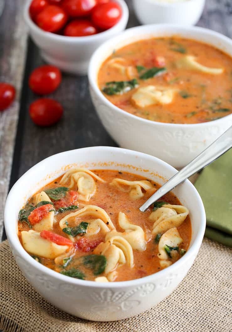 This Instant Pot Tomato Tortellini Soup recipe is creamy and delicious with spinach, chicken and a blend of perfect spices. It's a filling soup perfect for lunch or dinner, or simply when the craving for a comforting soup hits! 