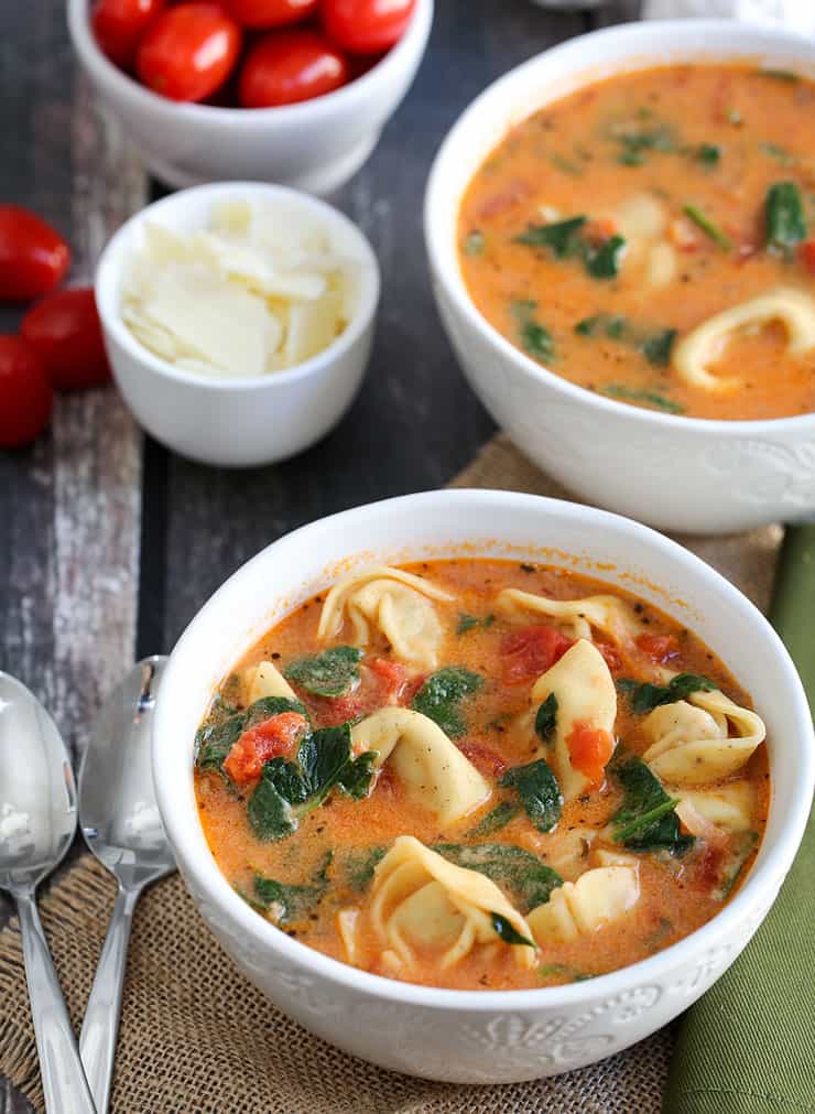 This Instant Pot Tomato Tortellini Soup recipe is creamy and delicious with spinach, chicken and a blend of perfect spices. It's a filling soup perfect for lunch or dinner, or simply when the craving for a comforting soup hits! 