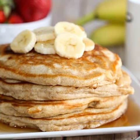 This is the best Whole Wheat Pancakes recipe! This delicious and fluffy pancake recipe has hints of irresistible vanilla and cinnamon and is a healthy option since it uses whole wheat flour. You'll never make regular pancakes again!