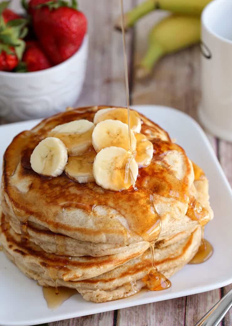 A plate of food on a table, with Pancake and banana