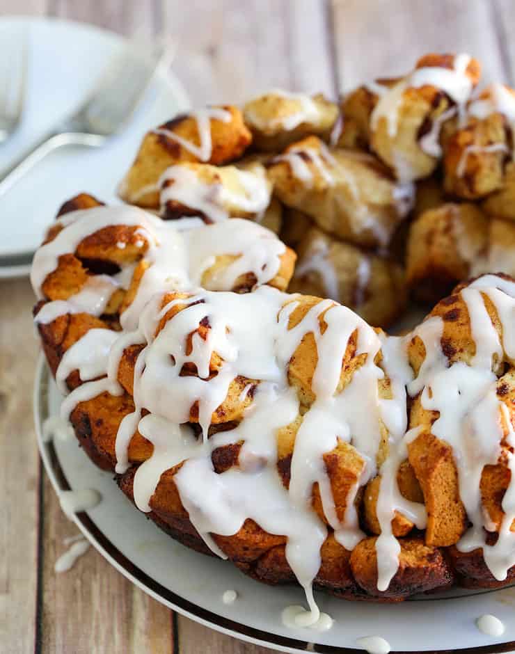 Cinnamon Bun Monkey Bread is a mountain of miniature cinnamon buns. Pull-apart pieces of dessert bundles that is so very simple to make.
