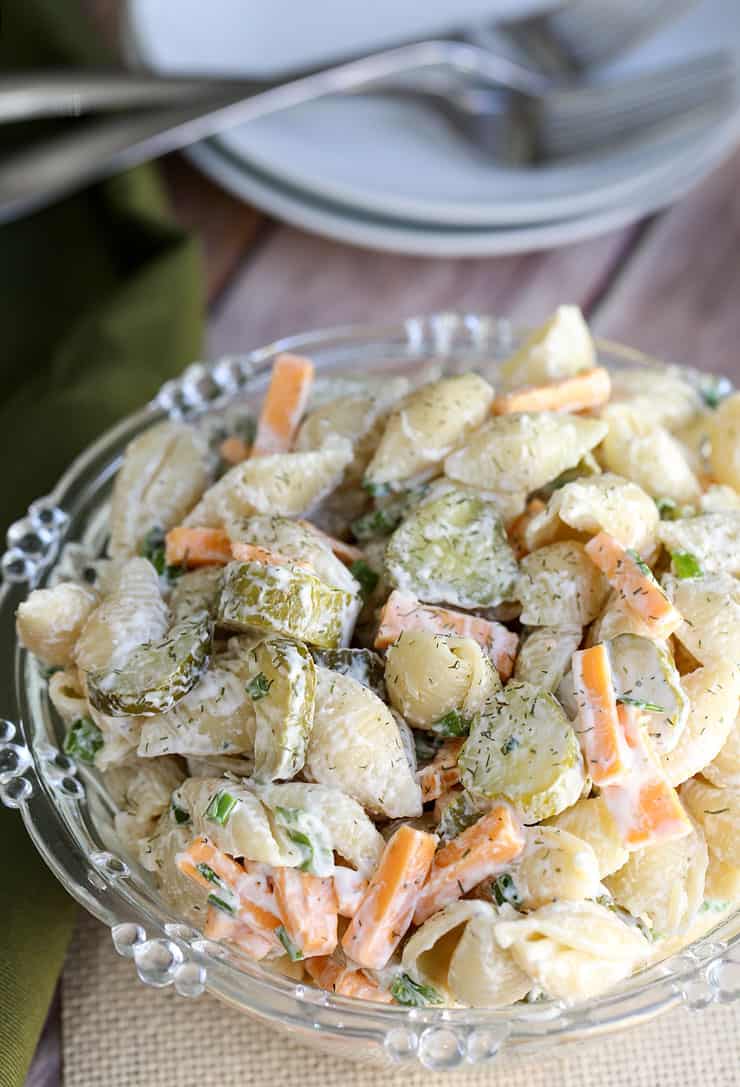 Calling all dill pickle lovers, this salad recipe is for you! This creamy Dill Pickle Pasta Salad has the tangy flavour of crunchy pickles, fresh dill, cheese, mayo and sour cream. It's the perfect Dill Pickle Pasta Salad is the perfect side for any BBQ or summer meal. 