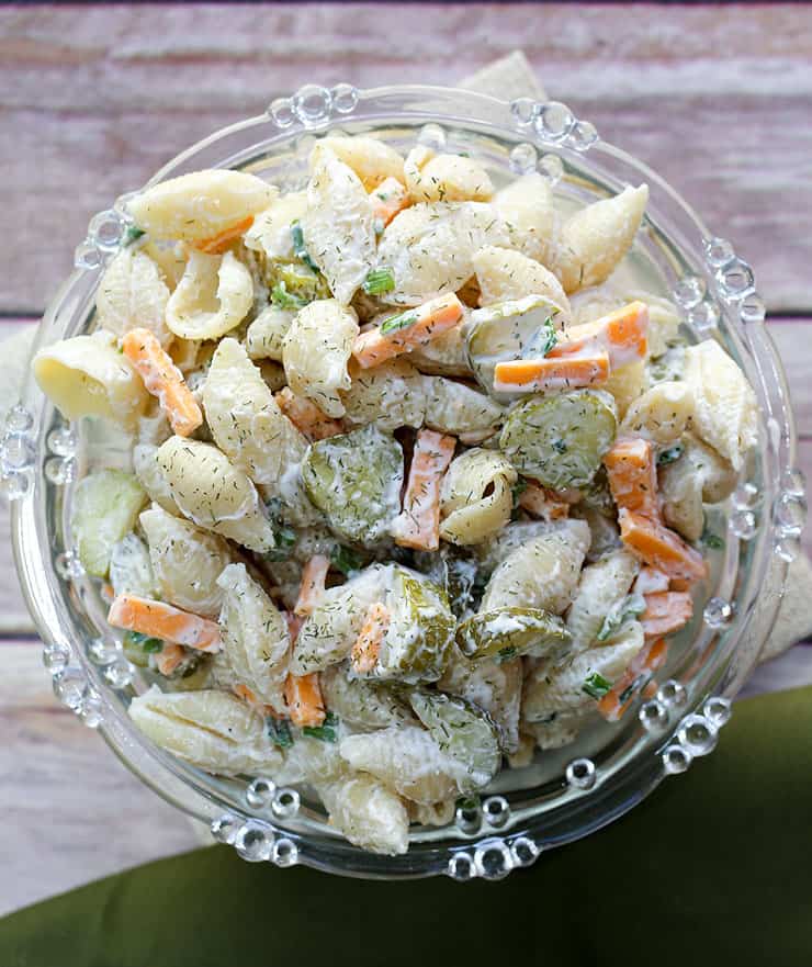 Calling all dill pickle lovers, this salad recipe is for you! This creamy Dill Pickle Pasta Salad is THE BEST and has the tangy flavour of crunchy pickles, fresh dill, cheese, mayo and sour cream. It's the perfect side for any BBQ or summer meal.