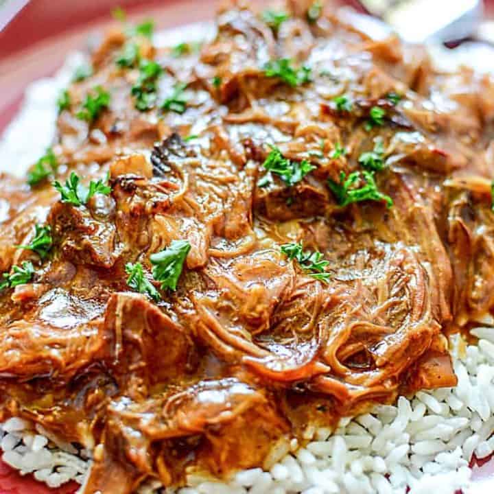 This easy 6-ingredient recipe for Slow Cooker Cherry Coke BBQ Pulled Pork has that smoky BBQ and sweet cola flavour that makes for a tender, juicy, and flavourful pulled pork.