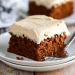 A piece of chocolate cake on a plate, with Fudge cake